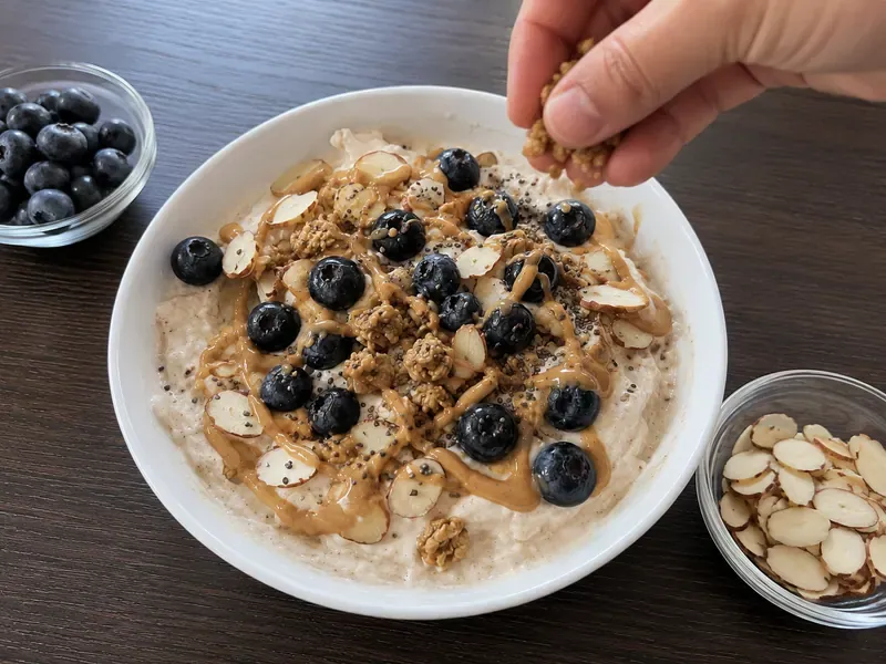 Blueberry almond Greek yogurt protein bowl base spooned into a serving bowl.