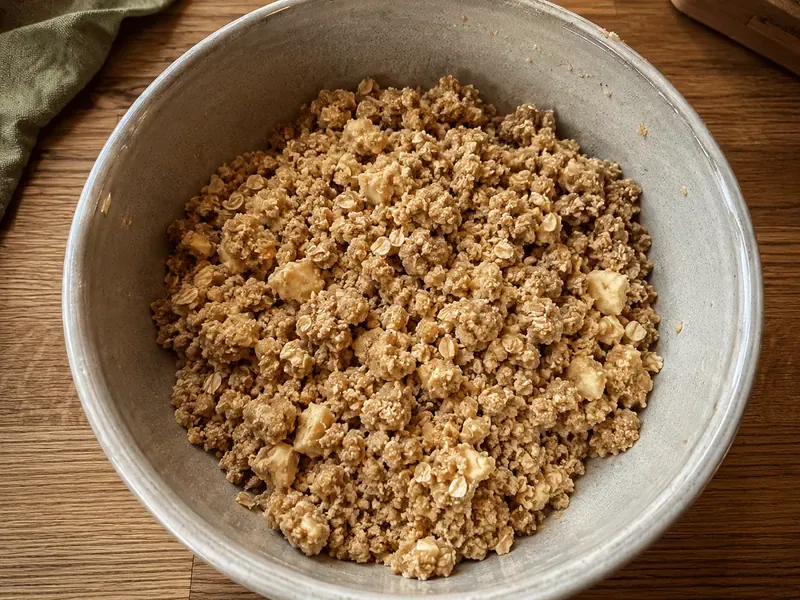 Flour, oats, brown sugar, cinnamon, and butter mixed into a crumb topping.
