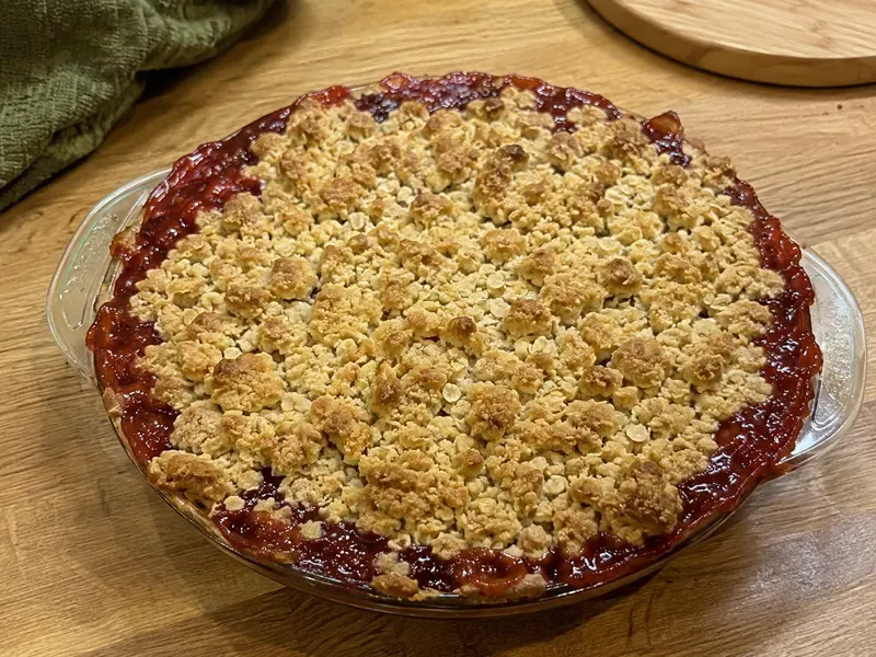 Cherry pie topped with crumble and baked until golden.