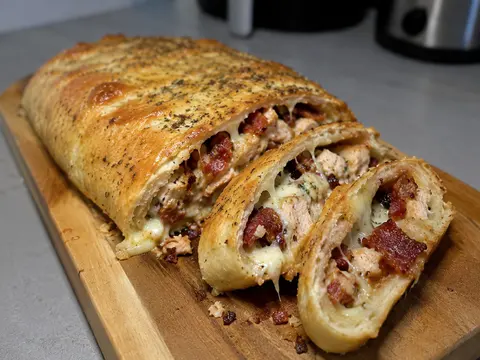 Chicken Bacon Ranch Stromboli with golden baked crust, chicken, bacon, ranch filling, and melted cheese.