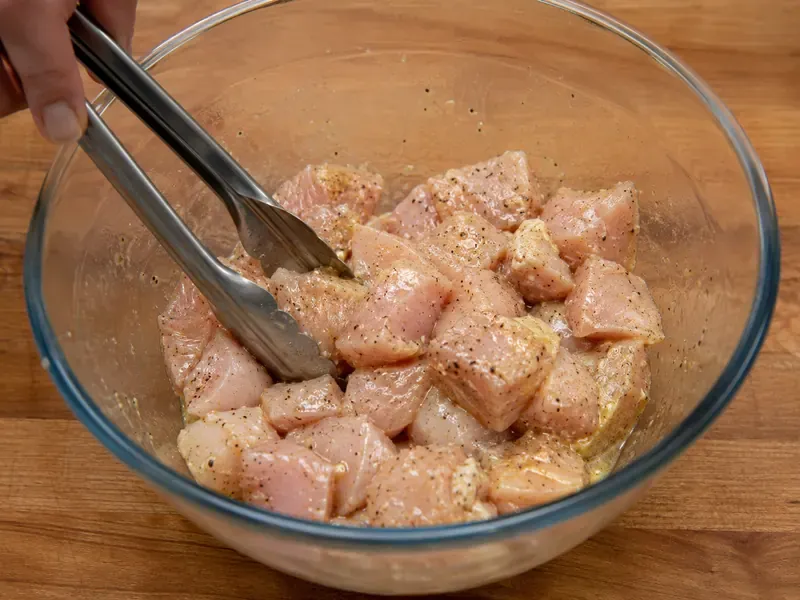 Chicken pieces seasoned with olive oil, salt, black pepper, and garlic powder.