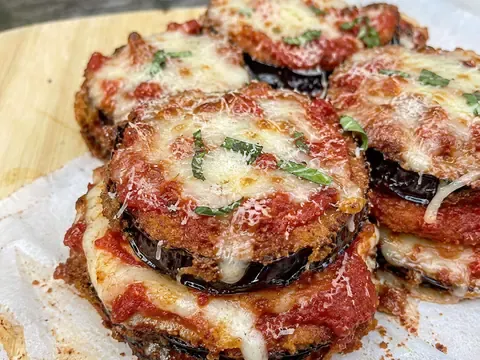 Crispy Eggplant Parmesan Stacks layered with marinara, mozzarella, parmesan, and basil.