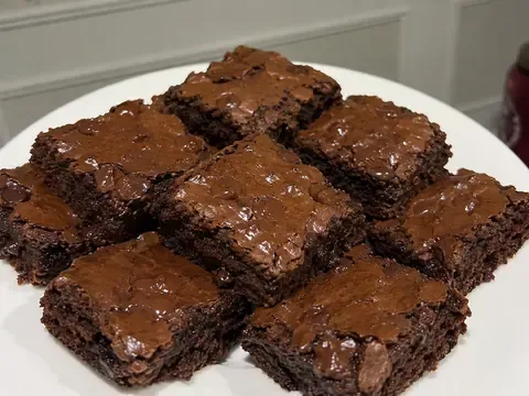 Dr Pepper Brownies cut into fudgy chocolate squares with glossy topping and soft chewy centers.