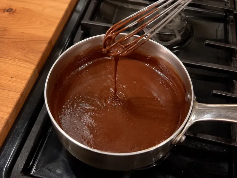 Chocolate topping made with butter, cocoa powder, Dr Pepper, and powdered sugar.