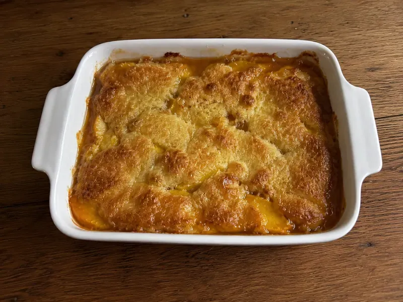 Easy peach cobbler baked until golden and bubbling.