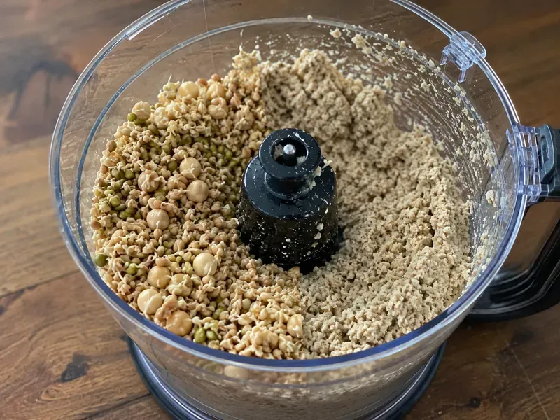 Sprouted grains and legumes ground in a food processor for bread dough.
