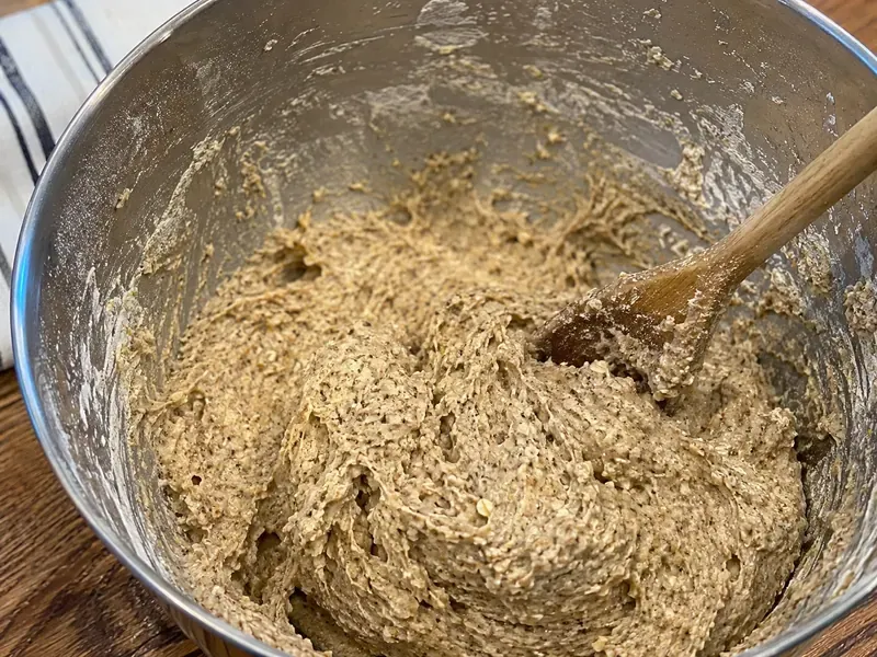 Sprouted grain mixture combined with flour and yeast to make dense bread dough.