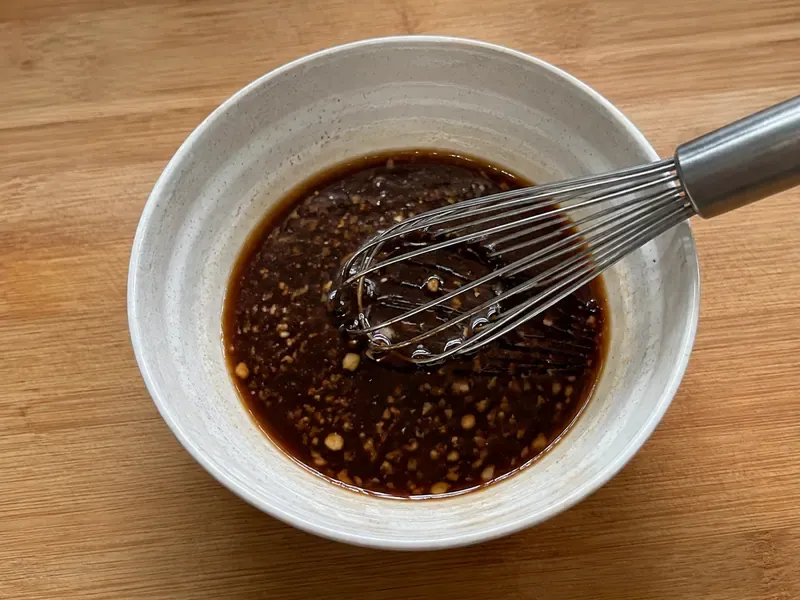 Garlic soy sauce mixed in a bowl for beef and broccoli meal prep boxes.