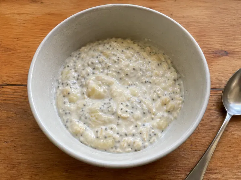 Greek yogurt banana protein bowl base resting and thickening in a bowl.