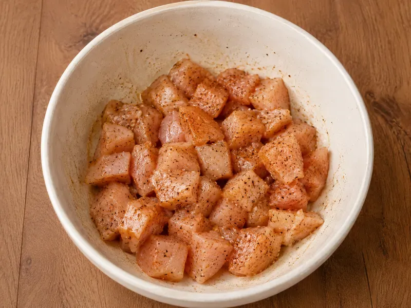 Chicken breast pieces seasoned with paprika, garlic powder, onion powder, salt, and pepper.