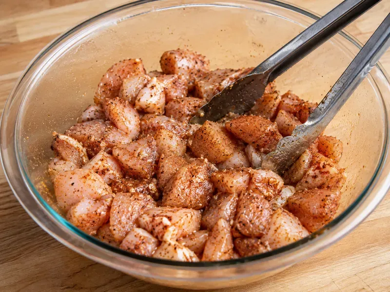 Chicken pieces tossed with smoked paprika, garlic powder, onion powder, salt, pepper, and cayenne.