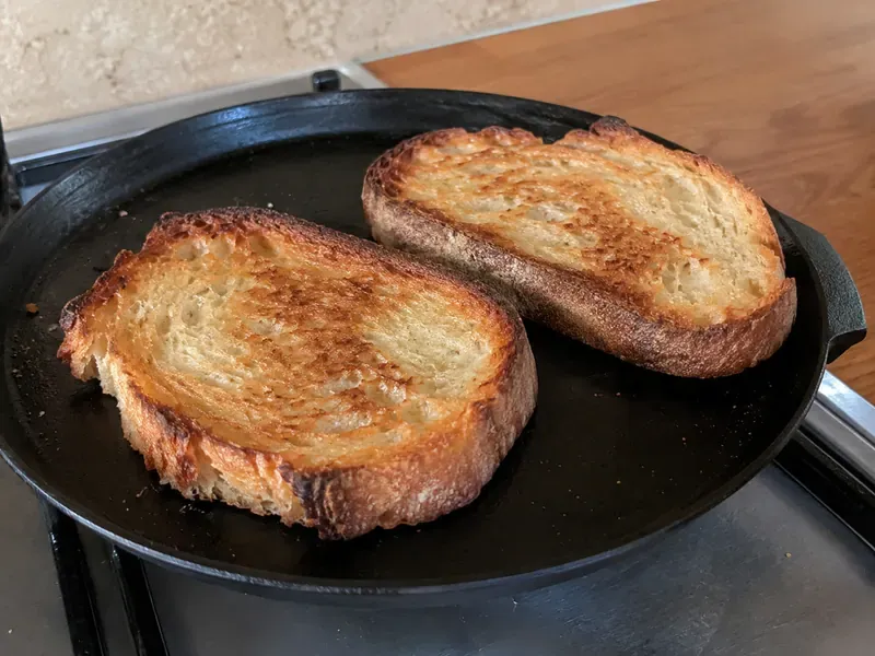 Thick sourdough bread toasted until crisp and golden.