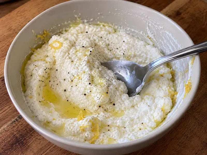 Ricotta mixed with lemon zest, lemon juice, olive oil, salt, and black pepper.