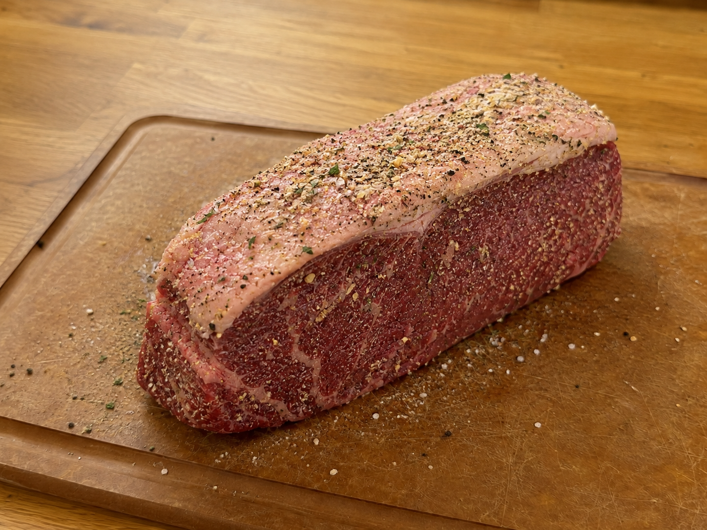 New York strip roast rubbed with olive oil, salt, pepper, garlic powder, and onion powder.