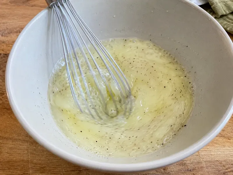 Egg whites whisked with milk, salt, black pepper, and garlic powder.