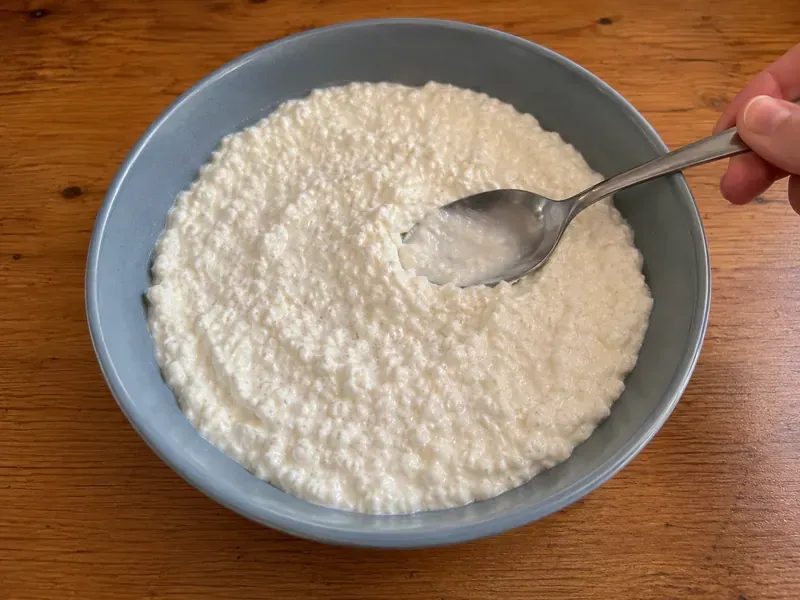 Creamy cottage cheese cheesecake mixture spooned into a serving bowl.