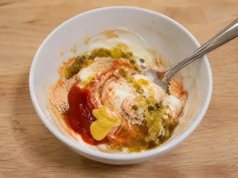 Burger sauce mixed in a small bowl with Greek yogurt, ketchup, mustard, and relish.