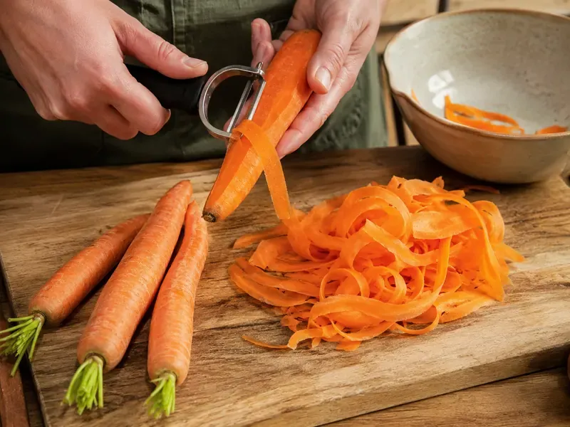 Carrots shaved into long thin ribbons with a vegetable peeler.